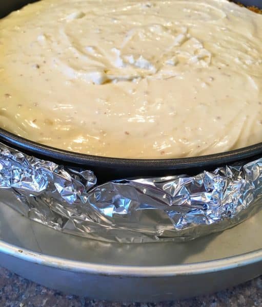White Chocolate Amaretto Cheesecake in spring form pan and in the water bath
