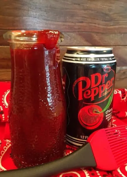 Cherry Dr Pepper BBQ Sauce in a jar with a can of Dr Pepper
