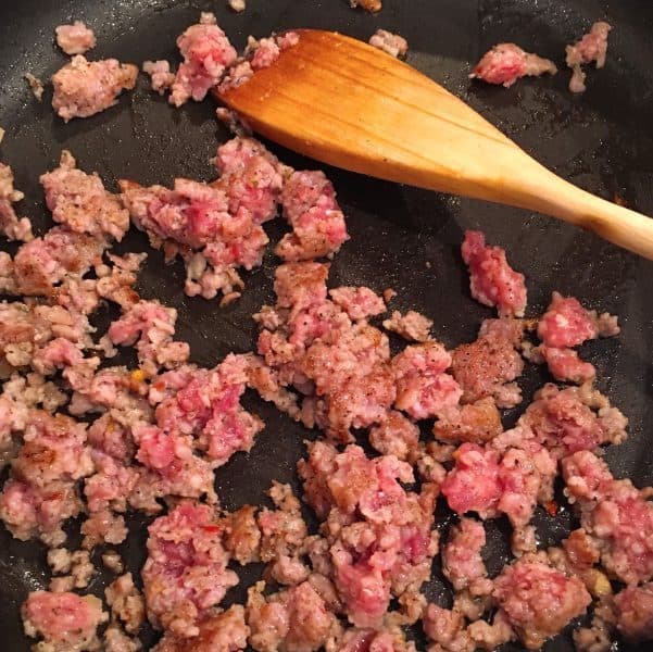 sausage frying up in a pan