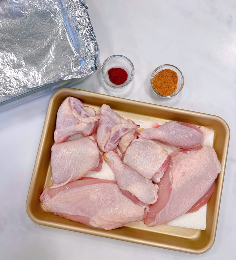 Cut-up chicken, season salt, and paprika.