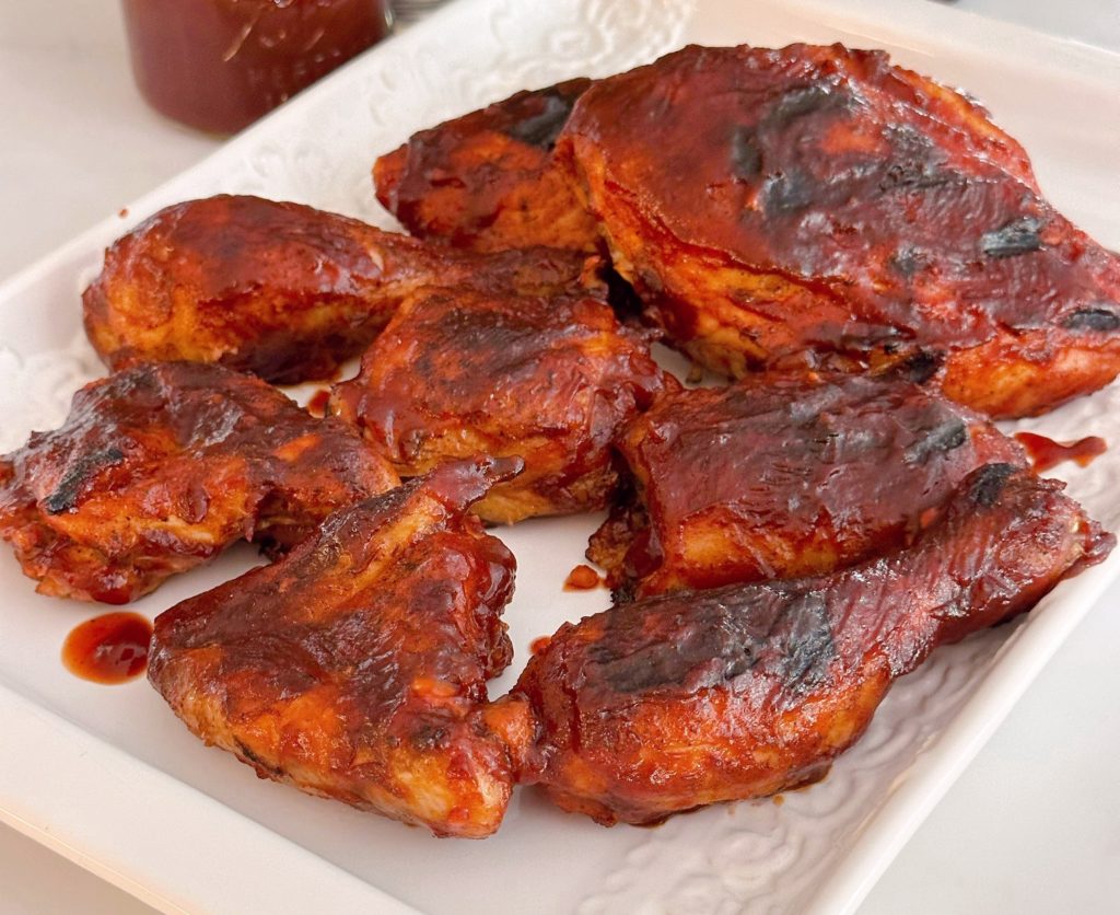 Close-up photo of grilled BBQ chicken.