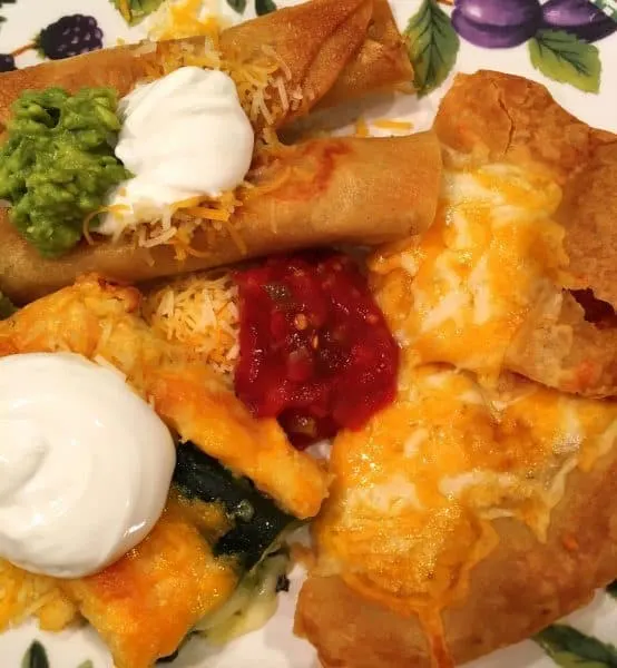 Plate full of Mexican food including chili relleno casserole