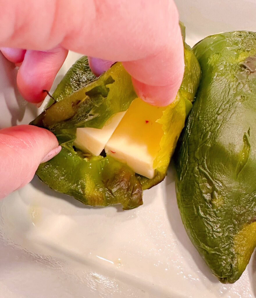 Peppers stuffed with sliced cheese.