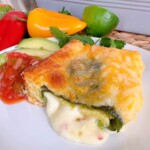 Chili Relleno Casserole serving on a dinner plate with sides.