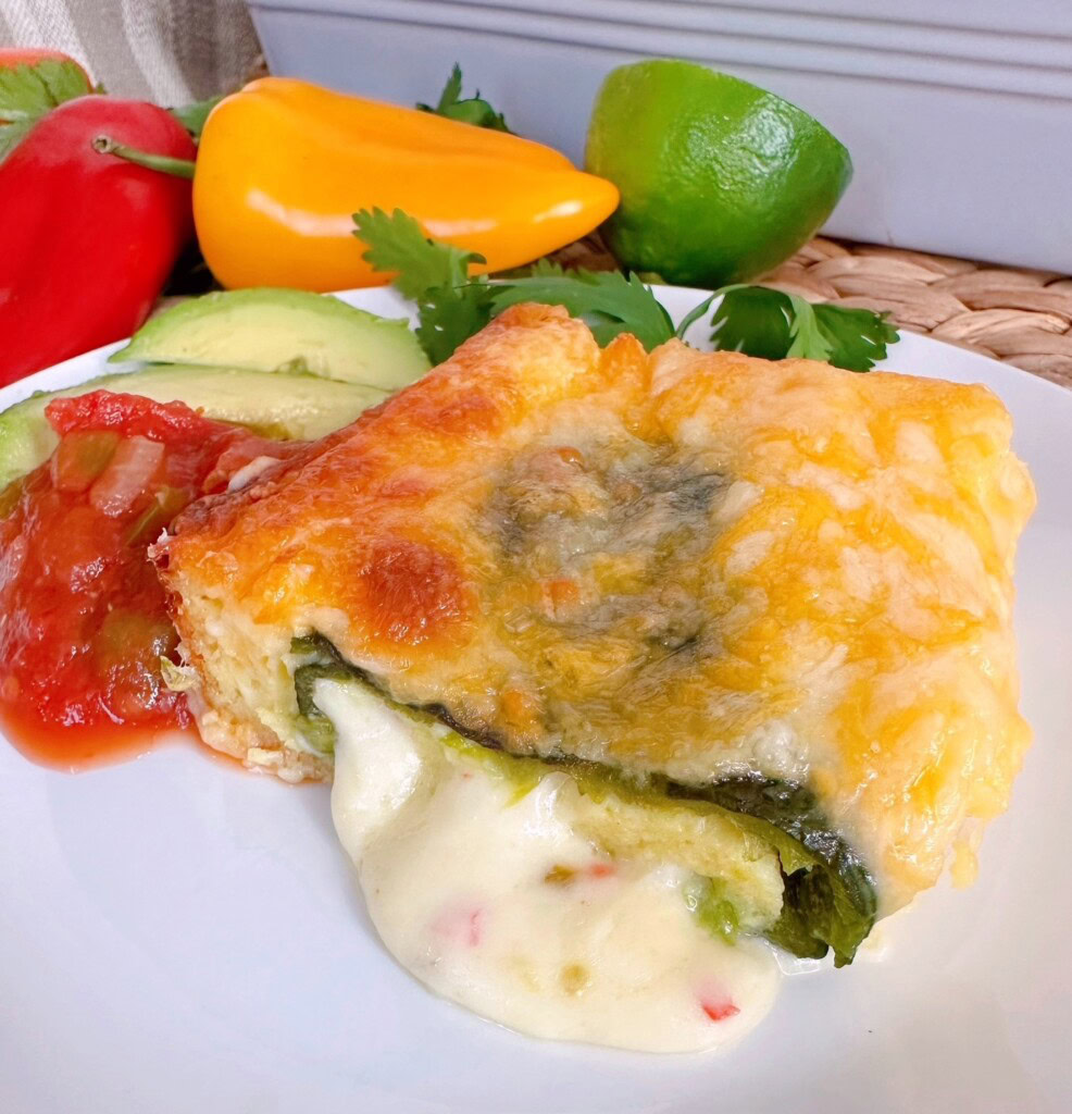 Chili Relleno Casserole serving on a dinner plate with sides.