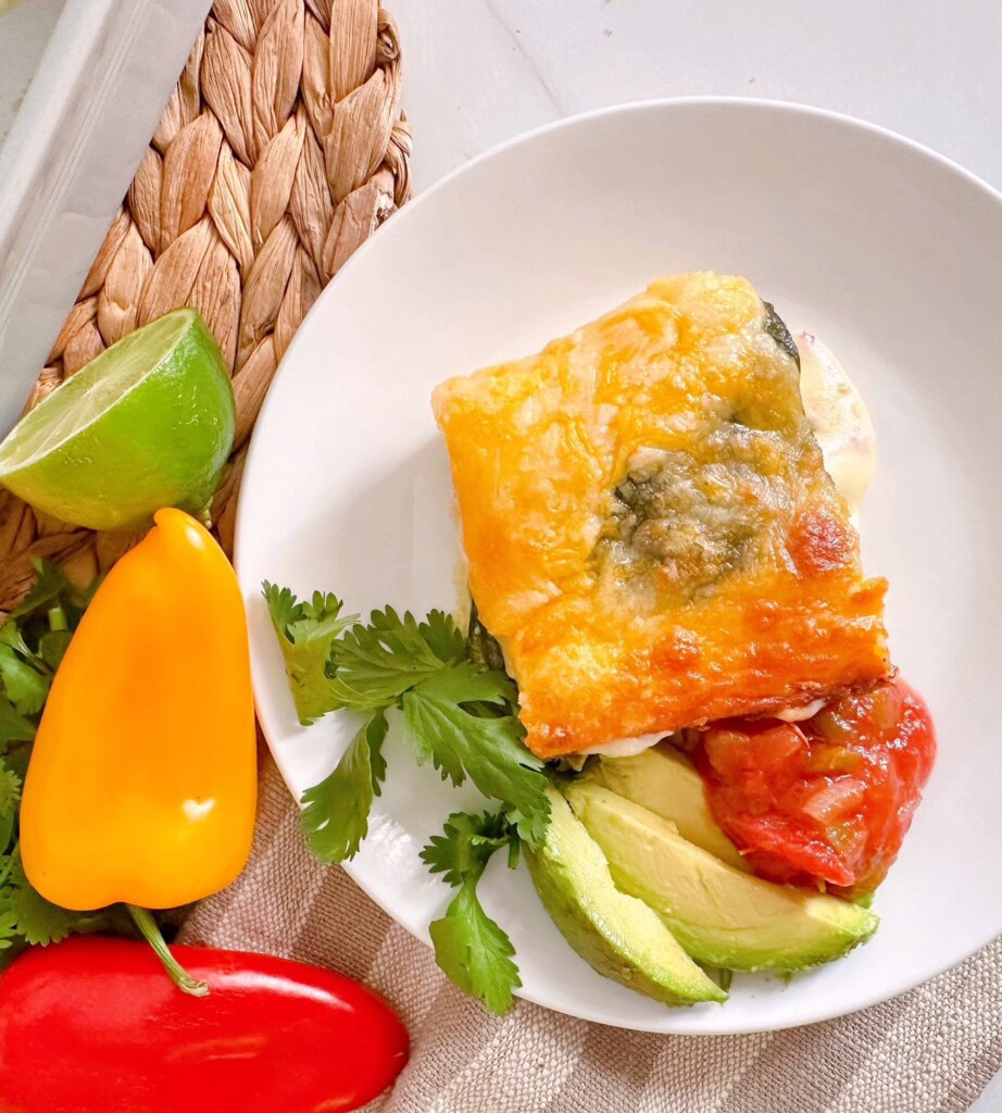 Chili Relleno Casserole served with salsa and avocado slices.