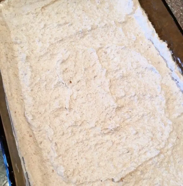 Cookie crumb and whip cream mixture spread in bottom of baking dish for bottom crust.