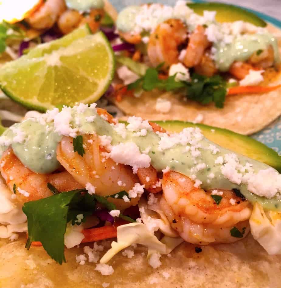 tacos made with shrimp,cabbage, cilantro and a special sauce