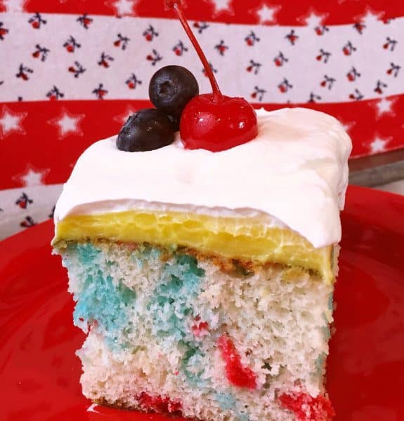 slice of red, white, and blue poke cake