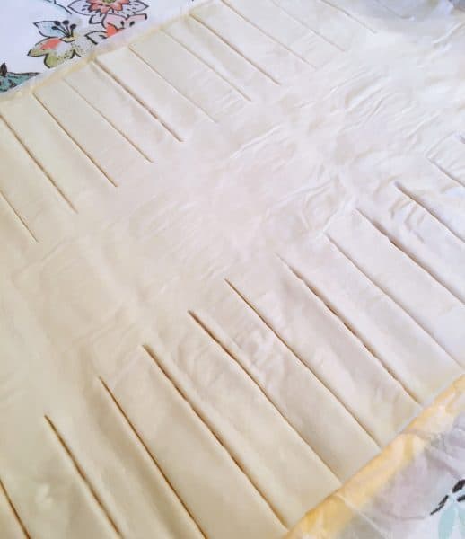 Puff pastry rolled out and each side cut into 1 inch strips for braid of danish