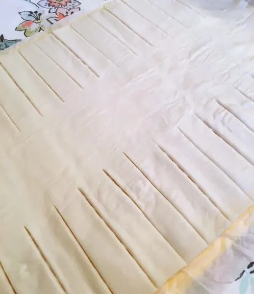 Puff pastry rolled out and each side cut into 1 inch strips for braid of danish