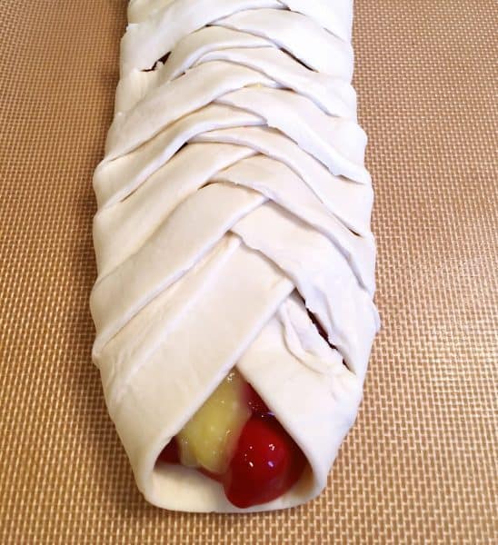 Pastry strips folded over each other to create the braid