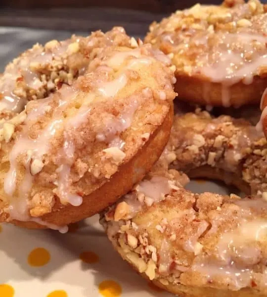 baked crumb donuts in a pile on a plate