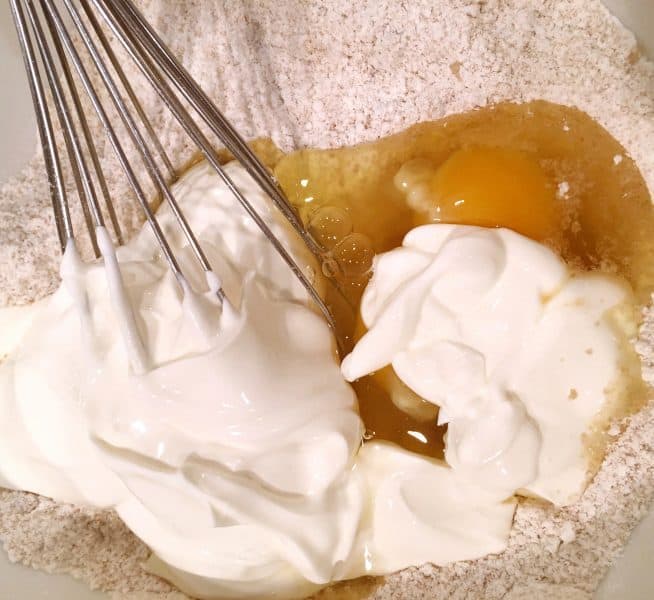 mixing the dough for the baked donuts