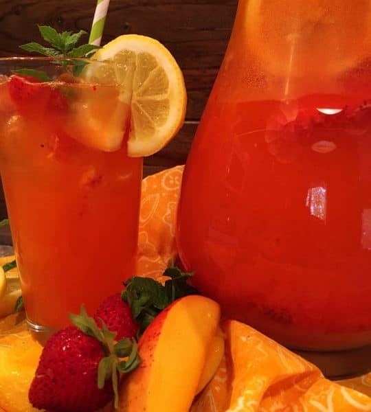 Glass full of Sparkling Strawberry Mango Lemonade