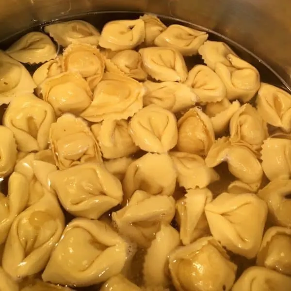 Tortellini cooking in large pot
