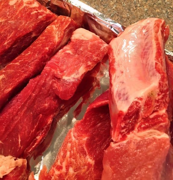 showing how to place the ribs bone down in the casserole dish