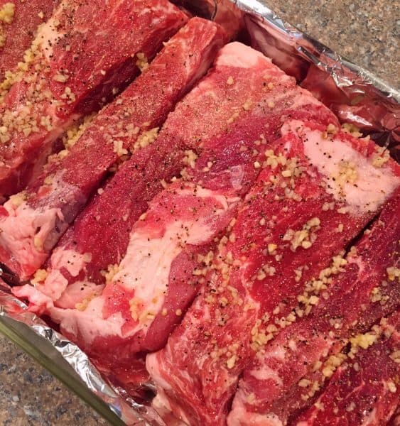 Country pork ribs covered in minced garlic and seasonings
