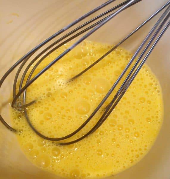 Whipping eggs with whisk