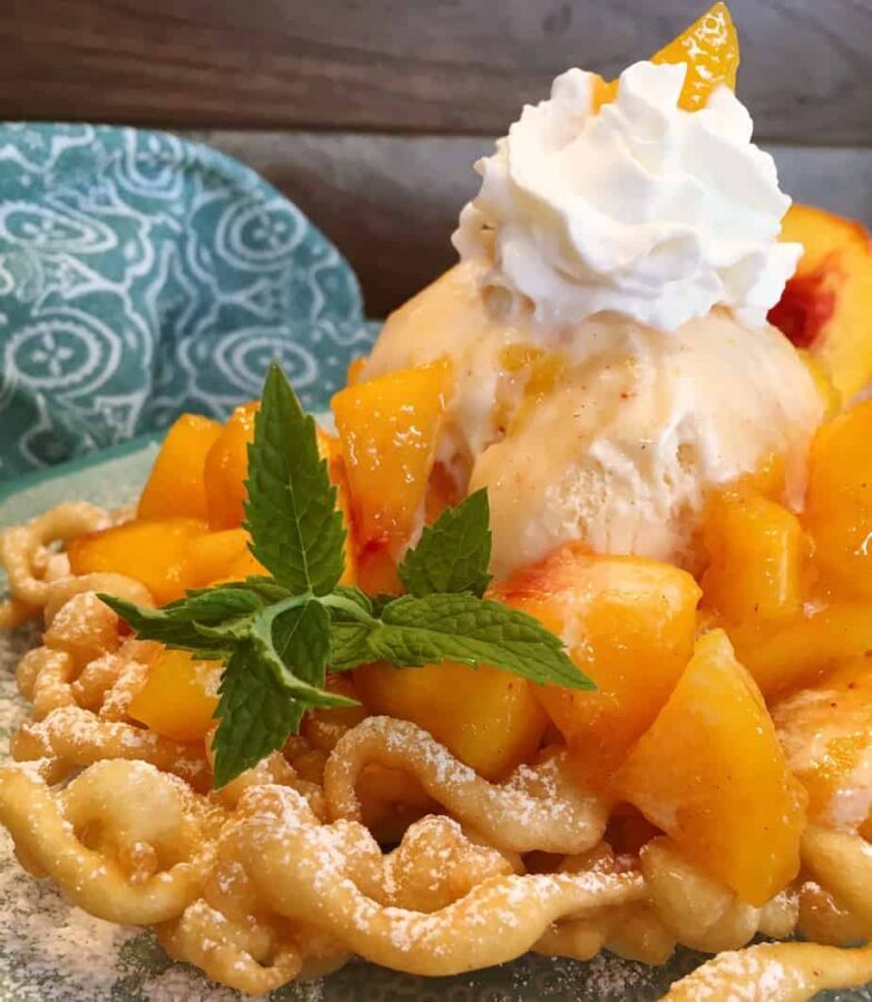 Funnel cake with peaches and cream