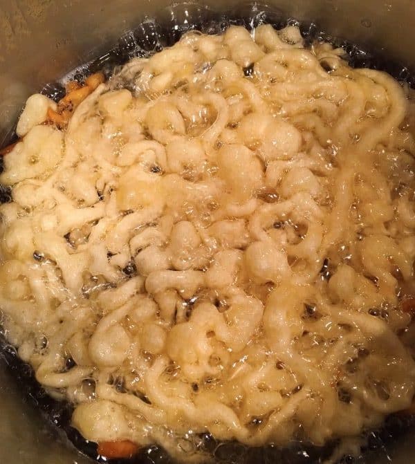 funnel cake frying in a pan