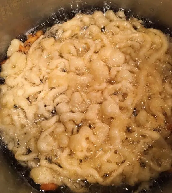 funnel cake frying in a pan