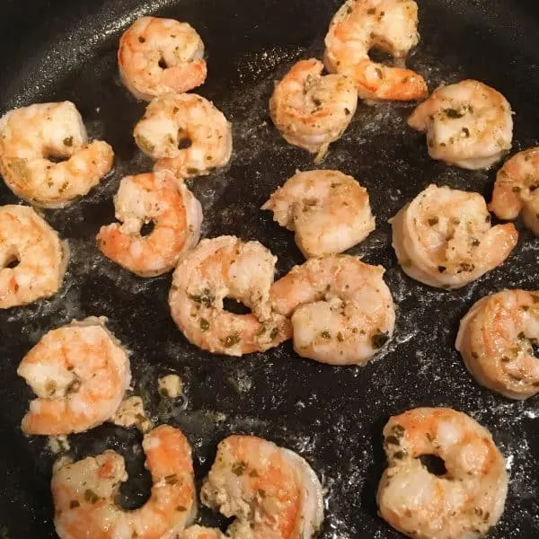 Shrimp cooking in a hot skillet