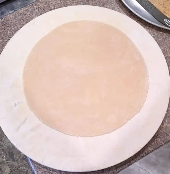 dough cut into a circle for galette