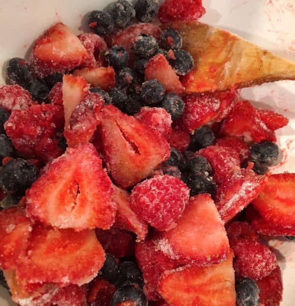 mixing berries with sugar and flour