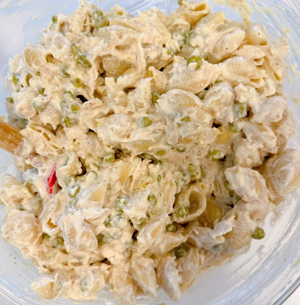 Tuna casserole ingredients all combined in the mixing bowl.