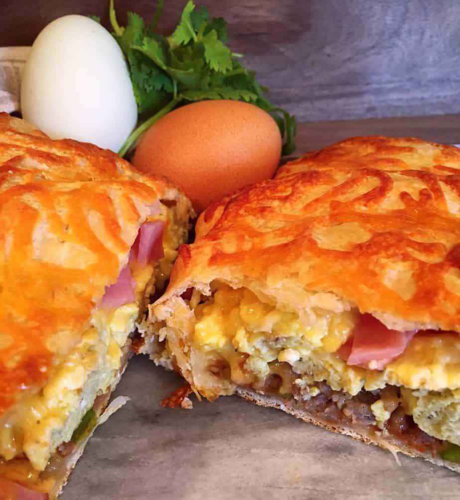 Sliced Breakfast Calzone on a cutting board.