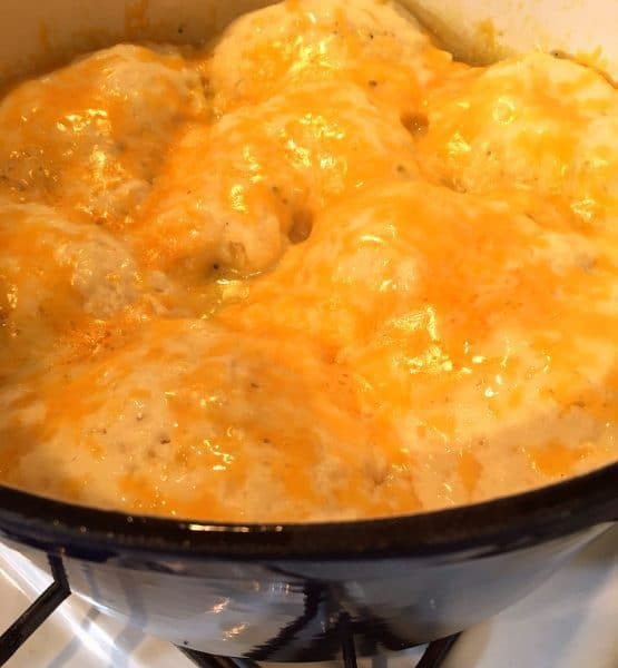 cheddar cheese melted on top of dumplings