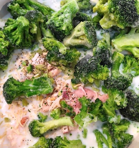 frozen broccoli and soup ingredients in a pot