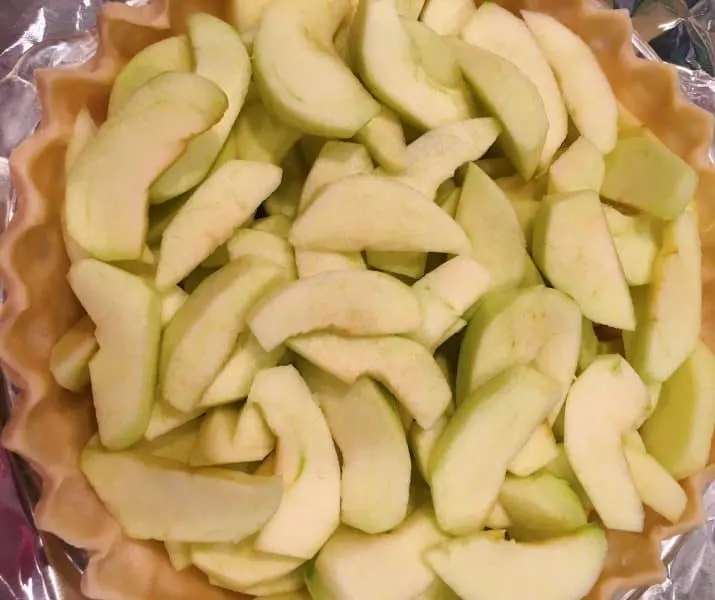 Fresh sliced apples in pie shell