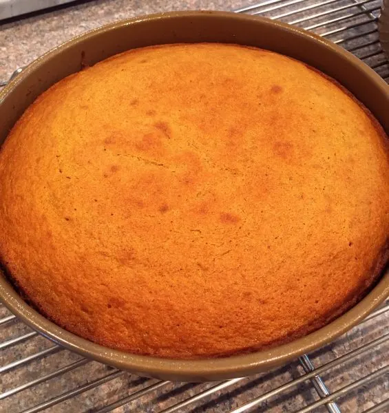 baked cakes cooling on cake rack