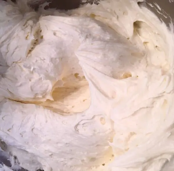 smooth cream cheese frosting in mixing bowl