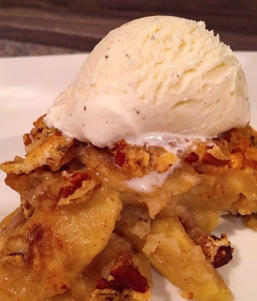 Apple Pecan Cobbler topped with vanilla ice cream