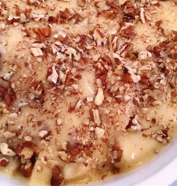 apple cobbler topped with chopped pecans