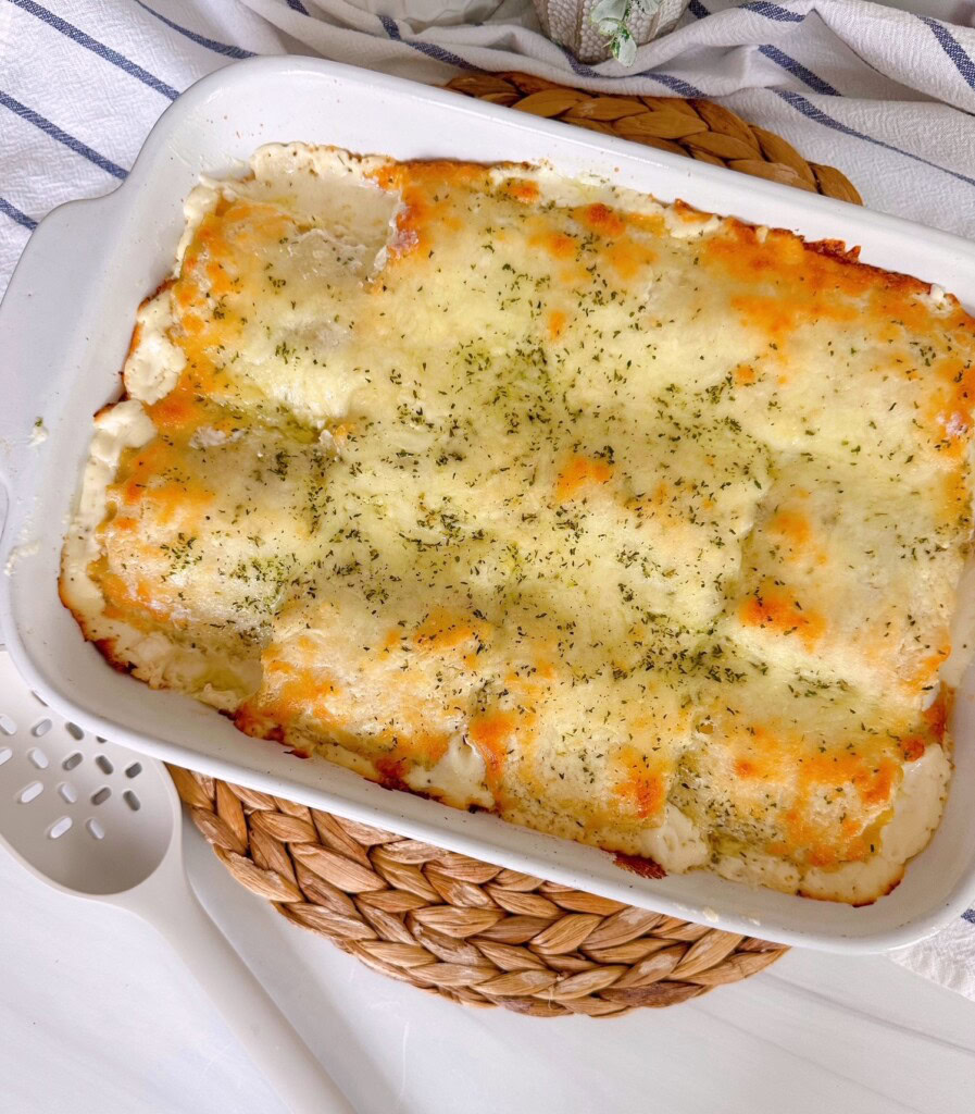 Baking dish with homemade alredo lasagna roll-ups.