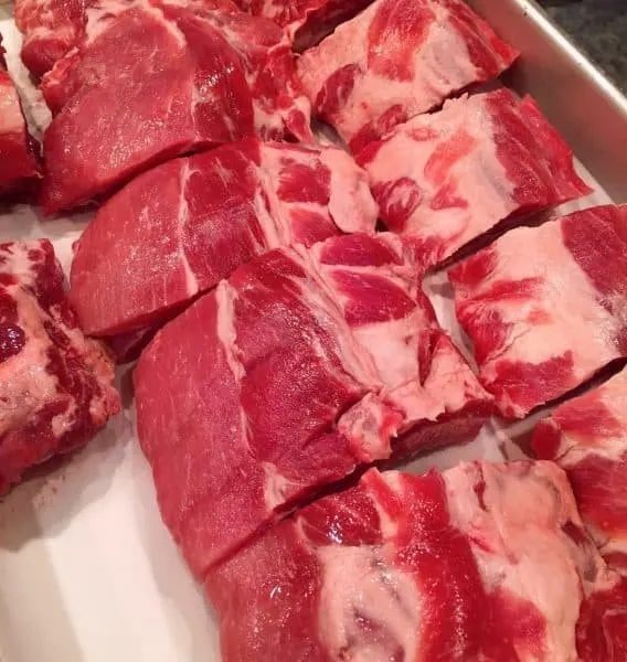 Baby Back Ribs in a large baking pan to slow cook in the oven.