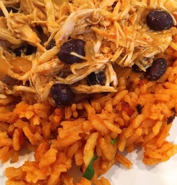 building a Mexican haystack. Rice, Chicken and beans.