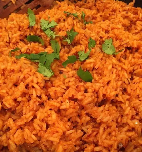 Pan full of fluffy Spanish Rice with chopped cilantro