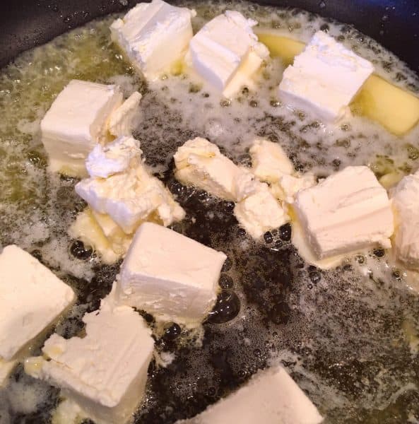 Butter and cream cheese in a skillet over medium heat for Alfredo Sauce