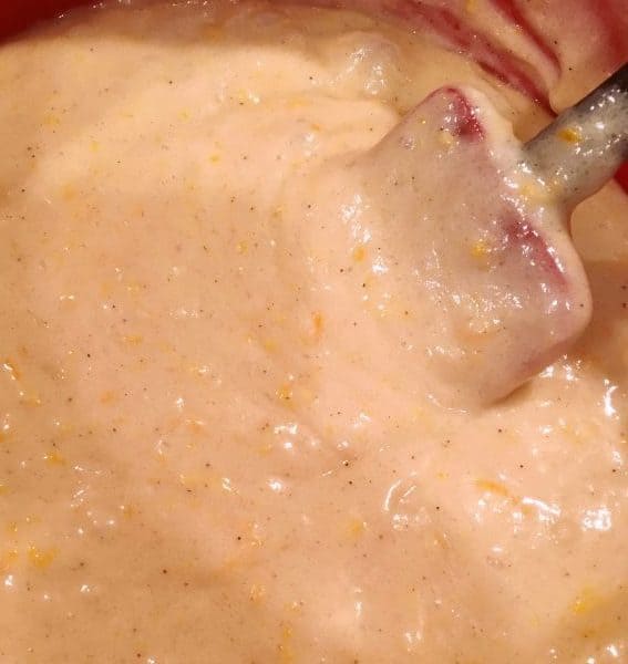 Orange zest cake batter being stir together