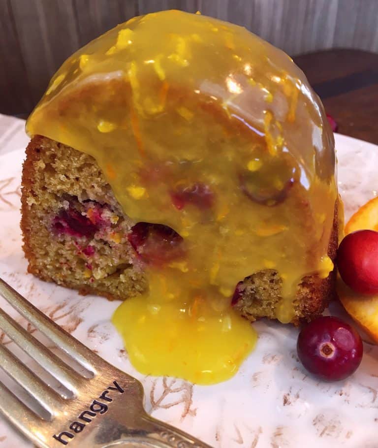 A cranberry orange cake with lemon sauce