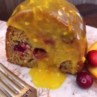 A cranberry orange cake with lemon sauce