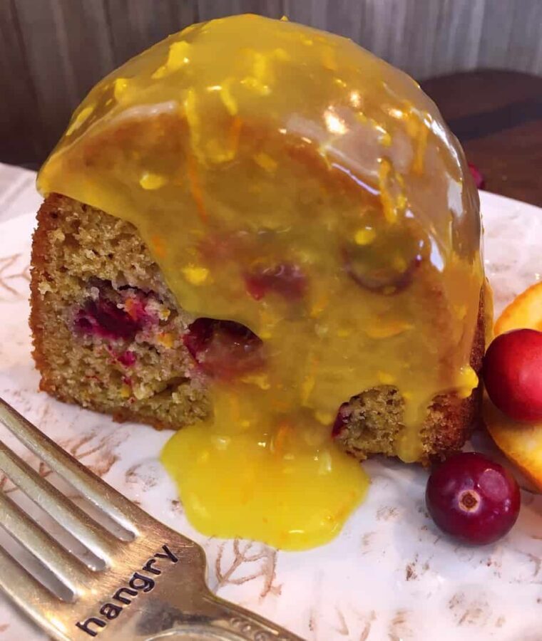 A cranberry orange cake with lemon sauce