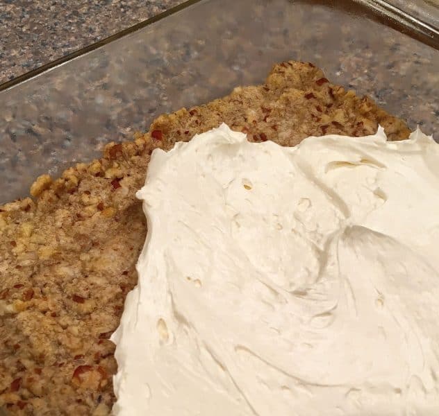 cream cheese layer on top of crumb crust for cranberry orange salad