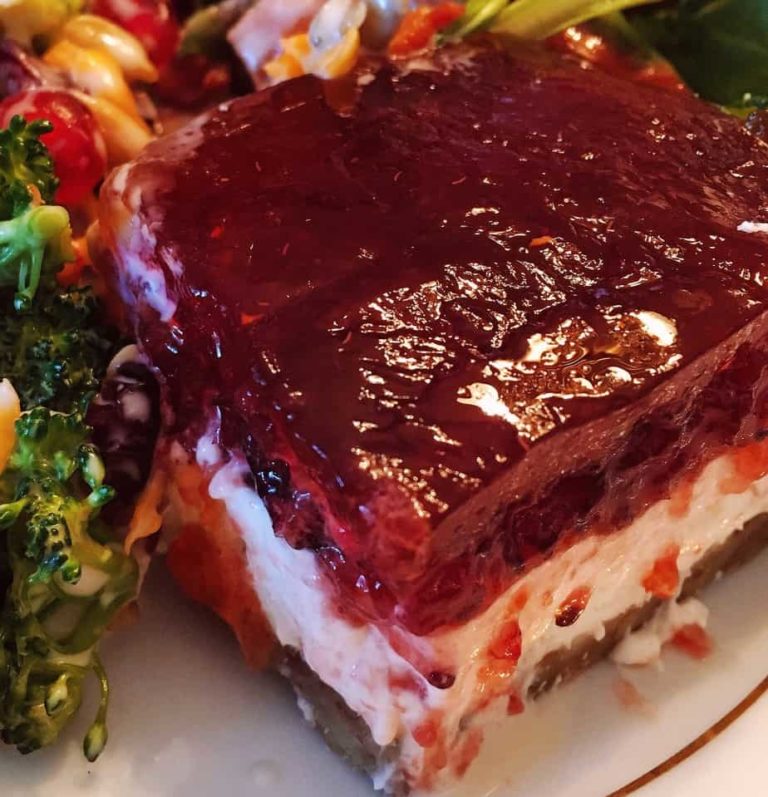 Cranberry orange jello salad on a dinner plate