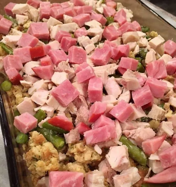 Left over diced ham and turkey on top of stuffing and veggies
